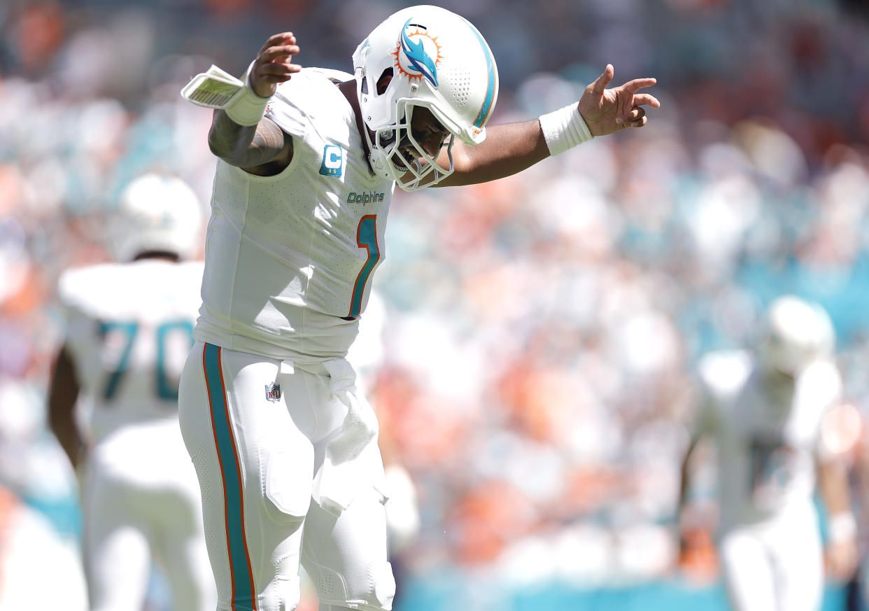 Tua Tagovailoa of the Miami Dolphins celebrates a touchdown against the Denver Broncos. (Photo by Carmen Mandato/Getty Images)