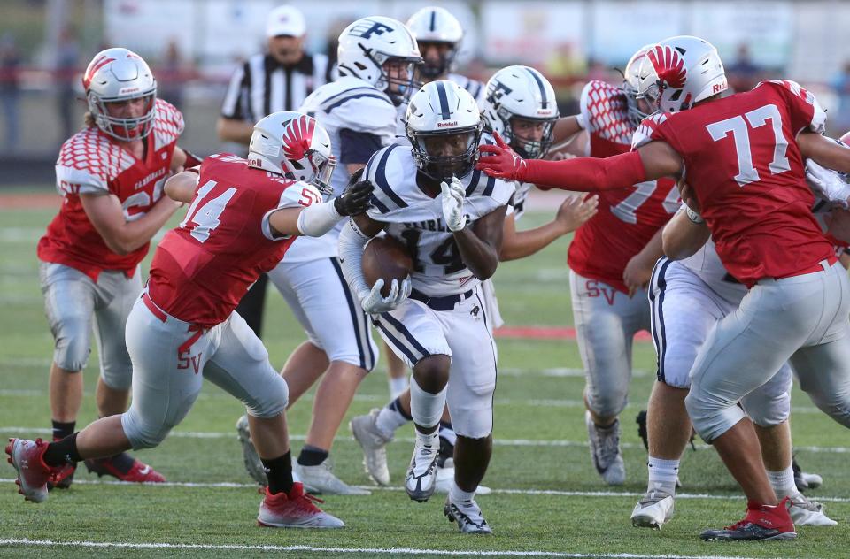 Fairless running back Peter Killy runs through a hole in Week 1 at Sandy Valley, Thursday, Aug. 18, 2022.