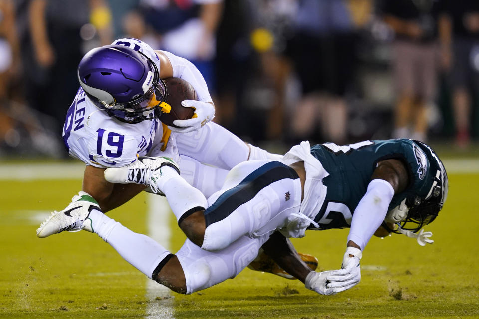 Minnesota Vikings wide receiver Adam Thielen (19) is tackled by Philadelphia Eagles safety C.J. Gardner-Johnson (23) after catching a pass during the second half of an NFL football game, Monday, Sept. 19, 2022, in Philadelphia. (AP Photo/Matt Slocum)