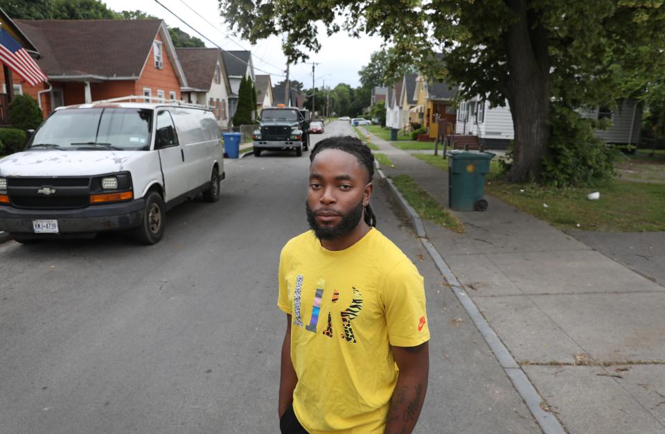 Marvin Taylor, 22, stands on Dale Street close to the intersection with Joseph Avenue, near where he was pulled out of his car and arrested by Rochester Police on May 7, 2024.