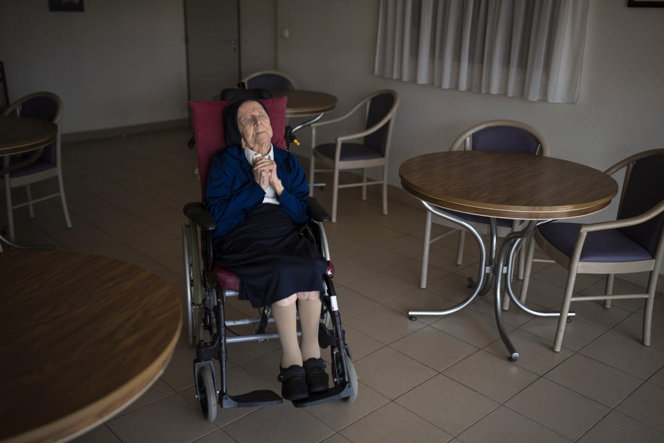 Sister Andre sits at the Sainte Catherine Laboure care home in Toulon, southern France, Wednesday, April 27, 2022. With the death of Kane Tanaka at age 119, the world's oldest human is now Lucile Randon, a French nun known as Sister Andre, aged 118, according to the The Gerontology Research Group. (AP Photo/Daniel Cole)