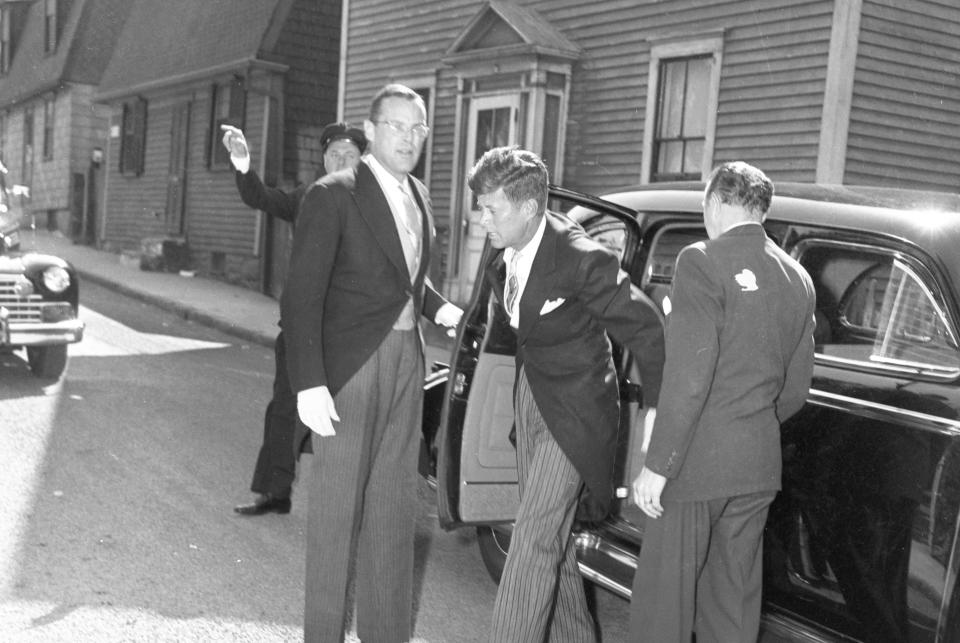 John F. Kennedy emerges from a limousine on his wedding day, Sept. 12, 1953.