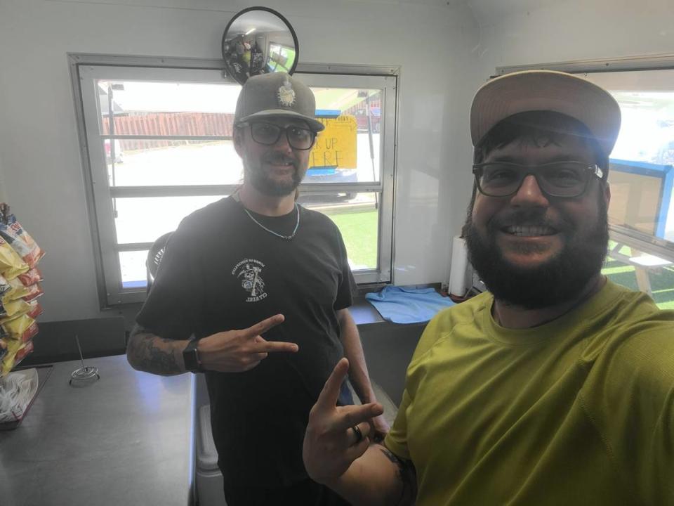 Cheese and Thank You owner and chef Austin Benz (right) stands beside his friend and co-chef, Adam Whitehead (left). The two make specialty grilled cheeses out of the Cheese and Thank You food truck.