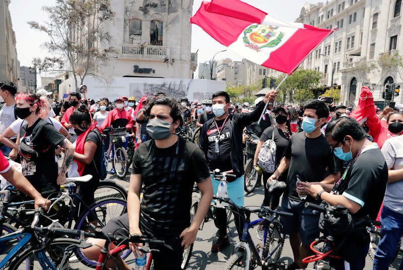 Peruvians take to the streets and celebrate after interim President Manuel Merino resigned in a television address, in Lima