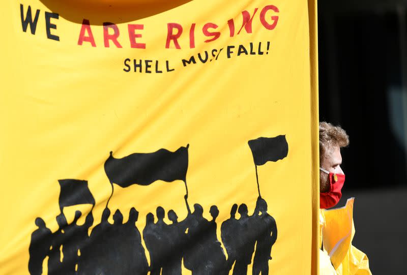 Banner is pictured during a demonstration outside of the Shell headquarters, in The Hague