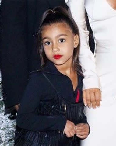 Kim Kardashian West/Instagram North West wears red lip to 2018 family Christmas Eve party