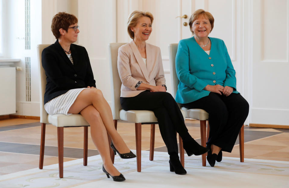 German defence Minister Ursula von der Leyen, incoming defence Minister Annegret Kramp-Karrenbauer and Chancellor Angela Merkel attend a ceremony at Bellevue Palace in Berlin, Germany, July 17, 2019. REUTERS/Fabrizio Bensch