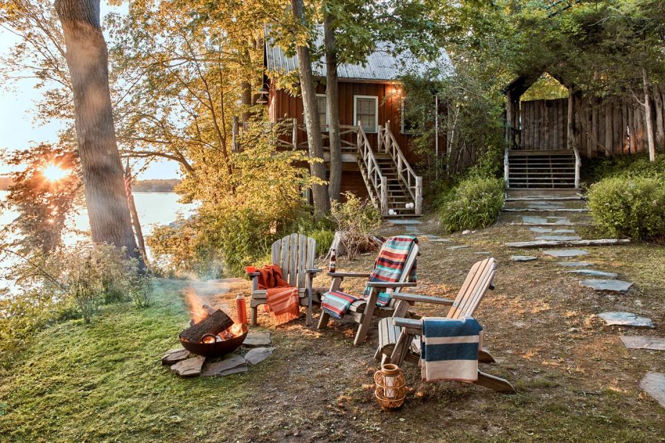 vacation home of vincent mazeau and natasha mazeau in new york’s copake lake exterior with campfire