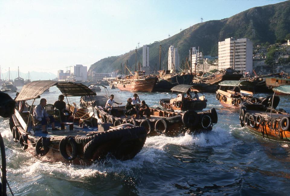 Sampan taxis drive passengers in Aberdeen Harbor.