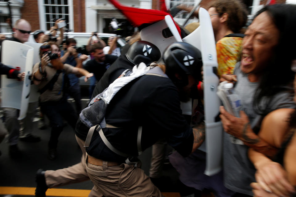 <p>Members of white nationalists clash a group of counter-protesters in Charlottesville, Va., on Aug. 12, 2017. (Photo: Joshua Roberts/Reuters) </p>