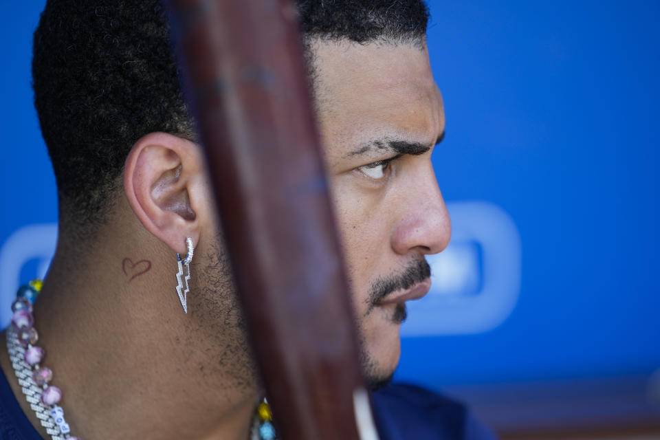 Tampa Bay Rays' Jose Siri sits in the dugout during the seventh inning of a baseball game against the Los Angeles Dodgers in Los Angeles, Sunday, Aug. 25, 2024. (AP Photo/Ashley Landis)