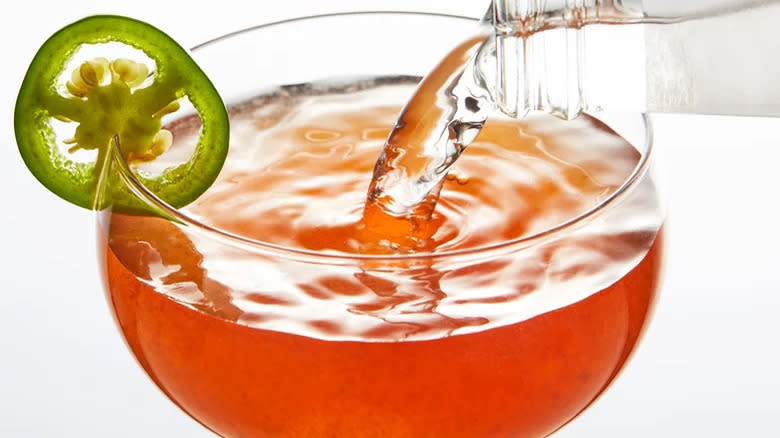 cocktail with jalapeno garnish