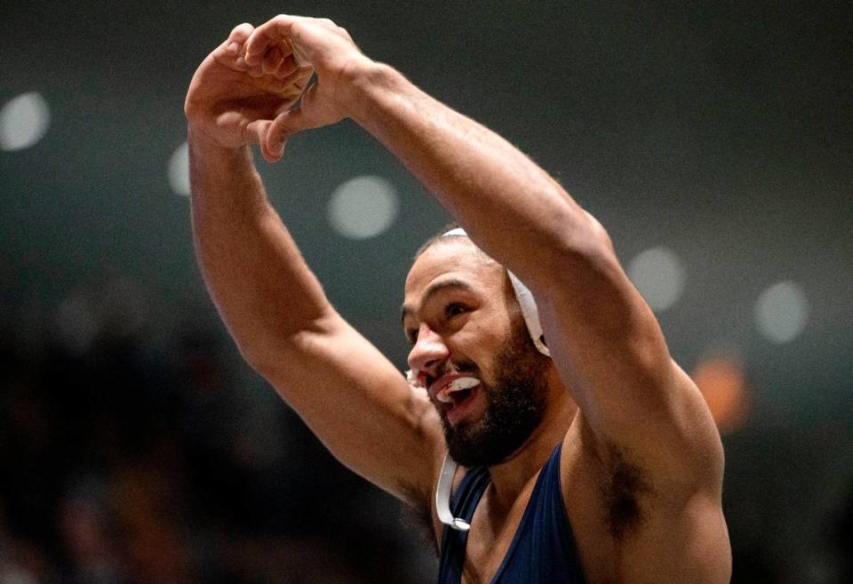 Penn State’s Shayne Van Ness makes a heart with his hands to the crowd after his win over Arizona’s Kyle Park in the 149 lb bout of the National Wrestling Coaches Association All-Star Classic at Rec Hall on Tuesday, Nov. 21, 2023.