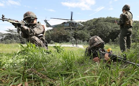 South Korean army soldiers aim their machine guns during the annual Ulchi Freedom Guardian exercise - Credit:  Hong Gi-won/ Yonhap