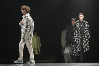 Models wear creations for the Fendi fall winter 22/23 collection, in Milan, Italy, Saturday, Jan. 15, 2022. (AP Photo/Antonio Calanni)