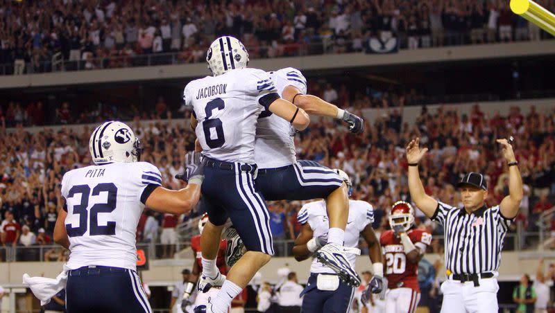 BYU’s McKay Jacobson (6) celebrates the game-tying TD with teammates as BYU and Oklahoma play at Cowboys Stadium in Arlington, Texas. Saturday, Sept. 5, 2009.