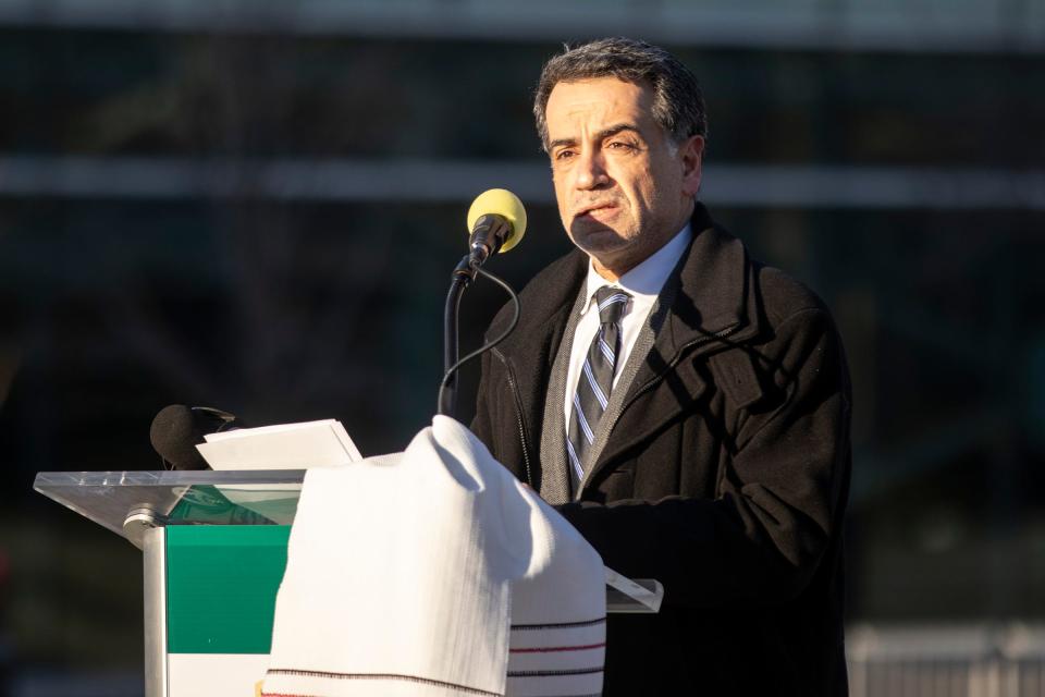 Wayne State University Vice President for Academic Student Affairs and Global Engagement Dr. Ahmad Ezzeddine speaks at a peace vigil to support those being affected by the Russian invasion of Ukraine at the flagpoles on Gullen Mall at Wayne State University in Detroit on Thursday, March 3, 2022. 