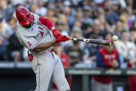 Los Angeles Angels' Jo Adell hits an RBI single off Seattle Mariners starting pitcher Robbie Ray during the first inning of a baseball game Friday, Aug. 5, 2022, in Seattle. (AP Photo/Stephen Brashear)