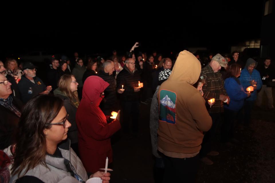 Dozens of people attend a vigil for missing Dee Warner on Saturday at her brother Gregg Hardy's farm in Tipton.