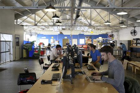 Designers work at computer stations at TechShop in the South of Market neighborhood in San Francisco, California April 24, 2014. REUTERS/Robert Galbraith