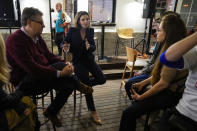 Independent candidate for the inner city seat of Wentworth, Allegra Spender, center, gestures as she holds a public forum ahead of next weekend's general election in Sydney, Australia on May 16, 2022. Australia's government, considered a laggard on combating climate change, faces a new threat in the form of highly-organized and well-funded independent election candidates who demand deeper cuts on greenhouse gas emissions. (AP Photo/Mark Baker)