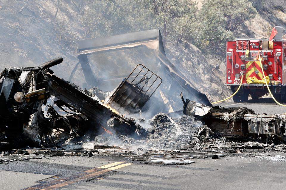 The driver of an SUV crossed over the double-yellow line on Highway 299 near the Whiskeytown Visitors Center and crashed into a semi on Thursday, Aug. 18, 2022. The collision killed the SUV driver while the big rig driver suffered unspecified injuries, the California Highway Patrol said. The crash caused a fire that raced up the hillside.