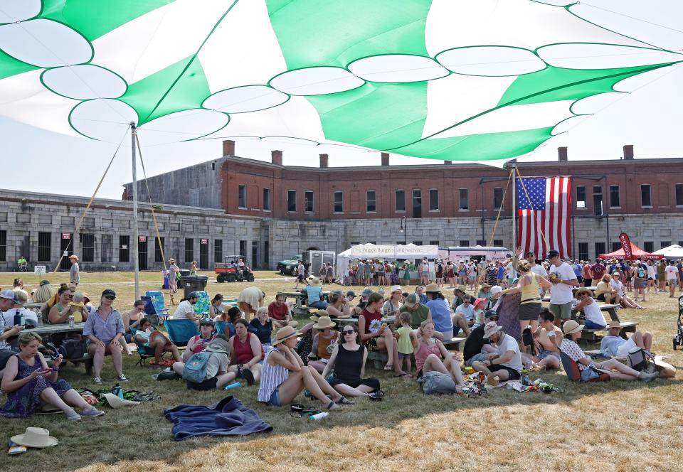 Festival goers try to beat the heat at the Newport Folk Festival on Friday, July 22, 2022.