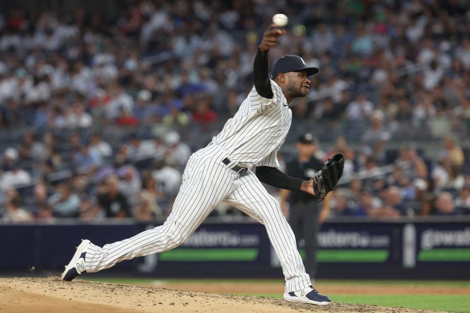 Jul 31, 2023; Bronx, New York, USA; New York Yankees starting pitcher Domingo German (0) delivers a pitch during the seventh inning against the Tampa Bay Rays at Yankee Stadium. Mandatory Credit: Vincent Carchietta-USA TODAY Sports