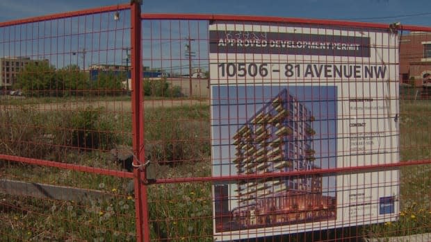 The lot at 81st Avenue and 105th Street has been vacant since the developer tore down the Strathcona Presbyterian Church to make room for a tower that's never been built. (Nathan Gross/CBC - image credit)