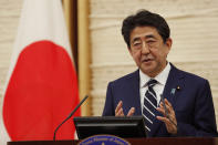 Japan's Prime Minister Shinzo Abe speaks at a news conference in Tokyo Monday, May 25, 2020. Abe lifted a coronavirus state of emergency in Tokyo and four other remaining areas on Monday, ending the restrictions nationwide. (Kim Kyung-hoon/Pool Photo via AP)