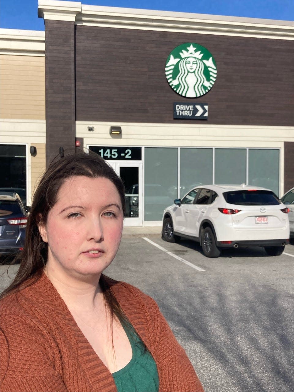 Holly Bogardus, a shift supervisor at Starbucks at The Ridge Marketplace in Rochester, is part of an effort to unionize. Bogardus, who also works as an elementary school teacher in Rochester, is seen outside the store Monday, April 3, 2023.