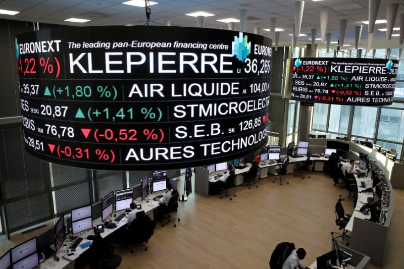 FILE PHOTO: Company stock price information, including Klepierre SA, is displayed on screens as they hang above the Paris stock exchange, operated by Euronext NV, in La Defense business district in Paris, France, December 14, 2016. REUTERS/Benoit Tessier/File Photo