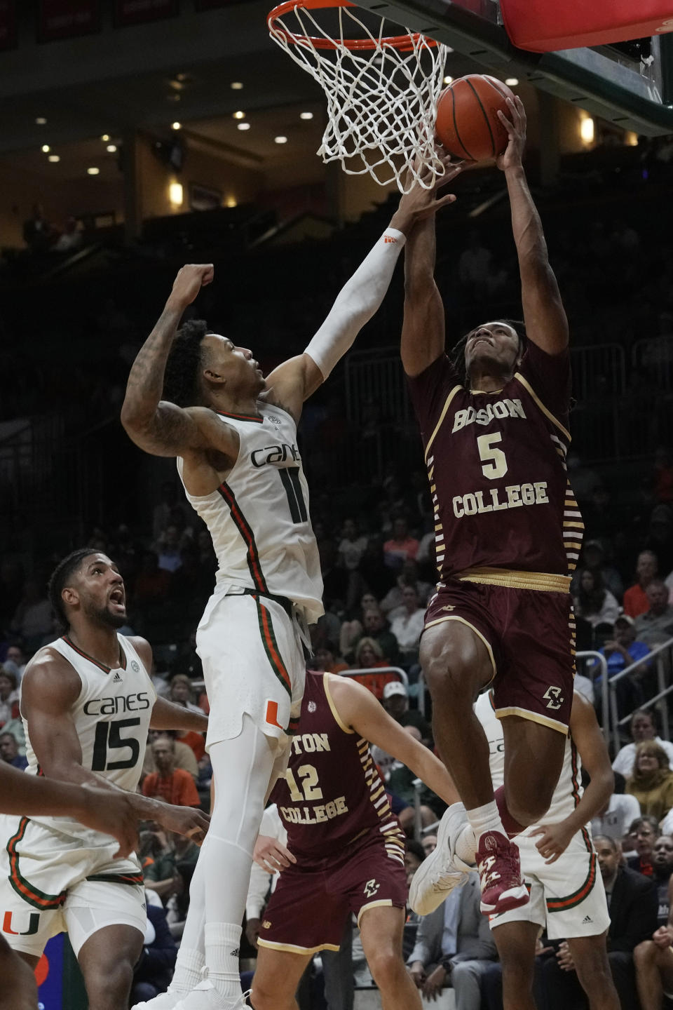 Boston College guard DeMarr Langford Jr. (5) drives to the basket as Miami guard Jordan Miller (11) defends during the second half of an NCAA college basketball game, Wednesday, Jan. 11, 2023, in Coral Gables, Fla. (AP Photo/Marta Lavandier)