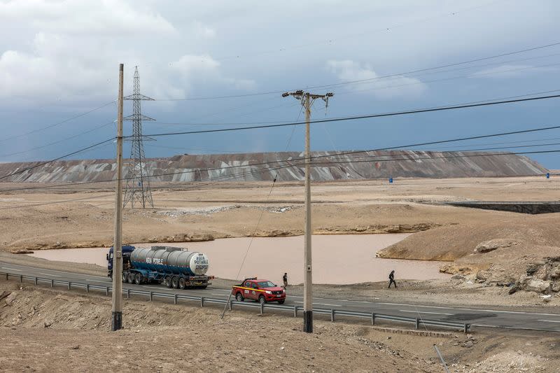 Vehicles travel along a road after heavy rains hit north of Chile near Calama