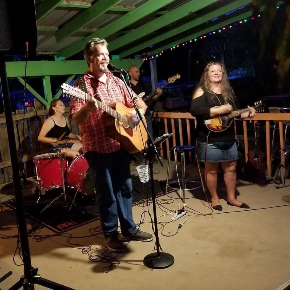 James Tobin and his most trusty guitar. That's wife Debbie on mandolin and the rest of the Dewey Decimators