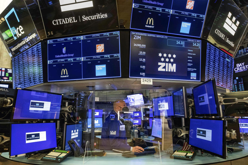 In this photo provided by the New York Stock Exchange, specialist Meric Greenbaum works at a post on the floor, Tuesday Feb. 2, 2021. Stocks were broadly higher in afternoon trading Tuesday, but shares of closely watched companies like GameStop and AMC Entertainment were falling sharply. (Colin Ziemer/New York Stock Exchange via AP)