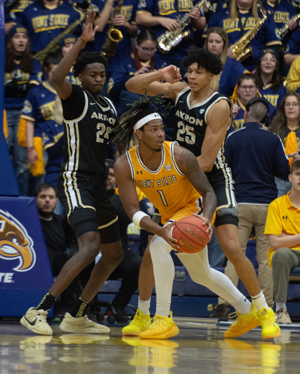 Akron seniors Ali Ali (24) and Enrique Freeman (25) put defensive pressure on VonCameron Davis of Kent State during a college basketball game on Jan. 19, 2024.