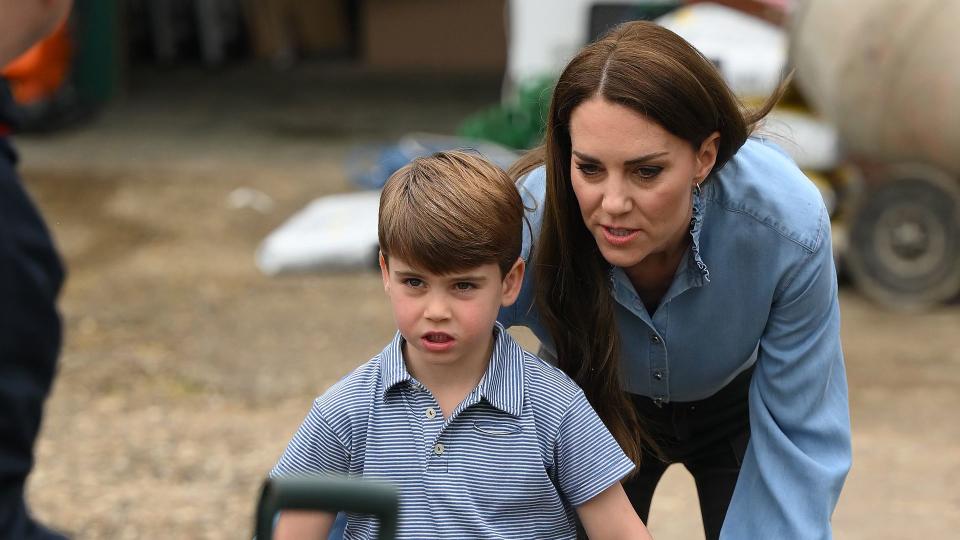 mother and son using wheelbarrow 