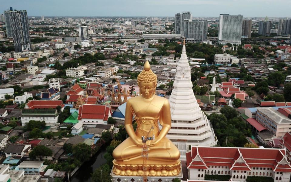 The giant Buddha statue of Wat Paknam Phasi Charoen temple is seen in Bangkok, Thailand on 10 June 2021 - Jorge Silva/Reuters