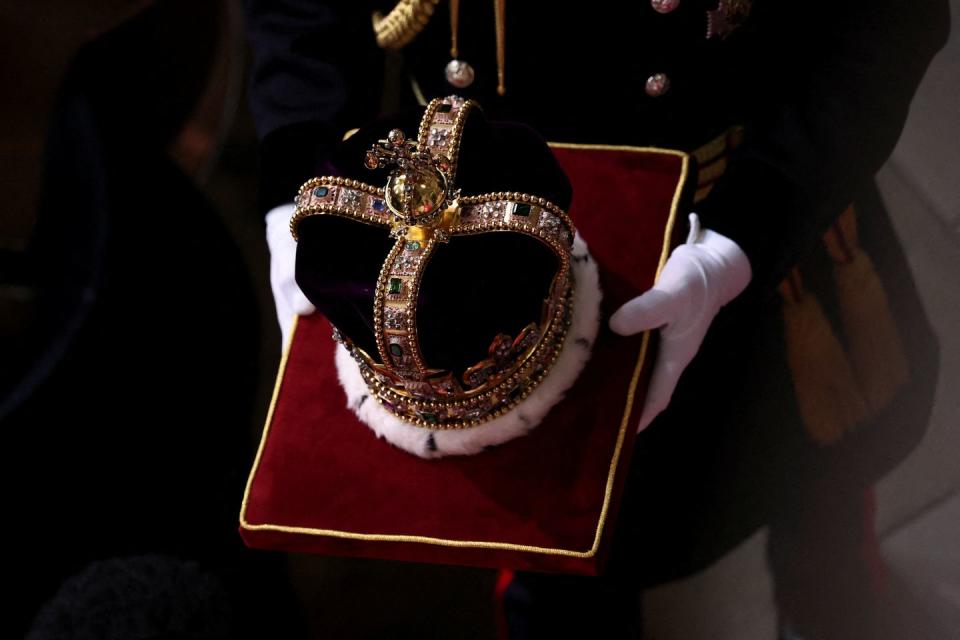 17th century st edwards crown is carried at westminster abbey in central london on may 6, 2023, ahead of the coronations of britains king charles iii and britains camilla, queen consort the set piece coronation is the first in britain in 70 years, and only the second in history to be televised charles will be the 40th reigning monarch to be crowned at the central london church since king william i in 1066 outside the uk, he is also king of 14 other commonwealth countries, including australia, canada and new zealand camilla, his second wife, will be crowned queen alongside him, and be known as queen camilla after the ceremony photo by phil noble pool afp photo by phil noblepoolafp via getty images