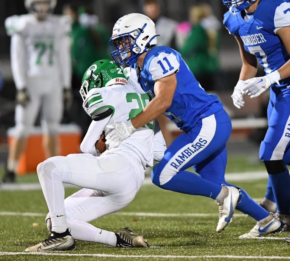 Windber's Jake Hostetler (11) takes down Portage running back Mason Kargo behind the line of scrimmage during a Heritage-WestPAC crossover contest, Oct. 28, in Windber.