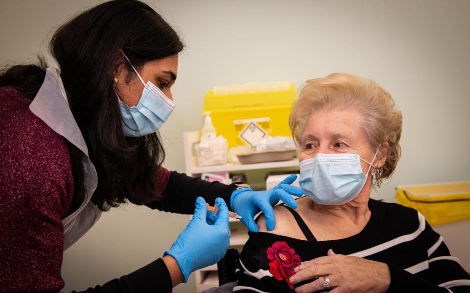 Patricia Main, 75, gets the vaccine at Boots in Halifax - Will Johnston 