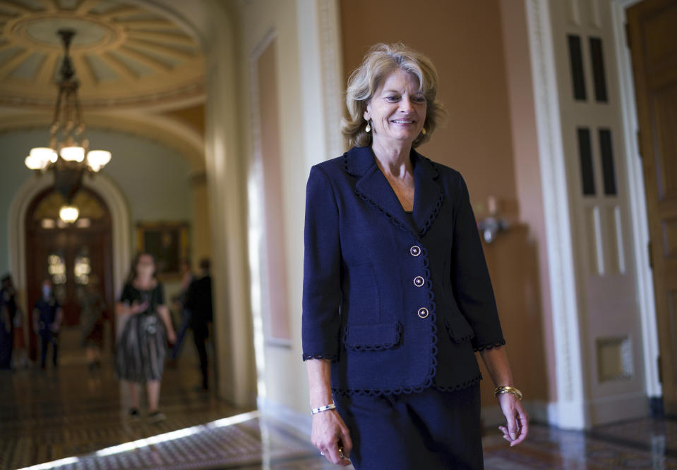 Sen. Lisa Murkowski, R-Alaska, leaves the chamber during a vote, at the Capitol in Washington, Thursday, Oct. 7, 2021. Senate leaders have announced an agreement to extend the government's borrowing authority into December, temporarily averting an unprecedented default that experts say would have decimated the economy, (AP Photo/J. Scott Applewhite)