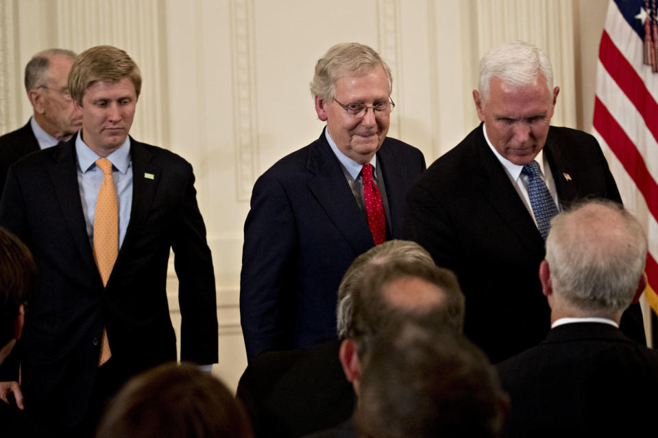 Senate Majority Leader Mitch McConnell and Vice President Mike Pence attend the U.S. Supreme Court nomination announcement ceremony in the East Room of the White House. (Bloomberg via Getty Images)