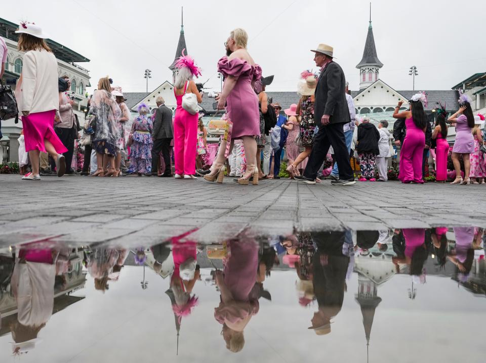 People check out the Paddock at Churchill Downs early Friday. Rain fell in the early morning hours before the 2024 Kentucky Oaks Friday, May 3, 2024 in Louisville, Kentucky.