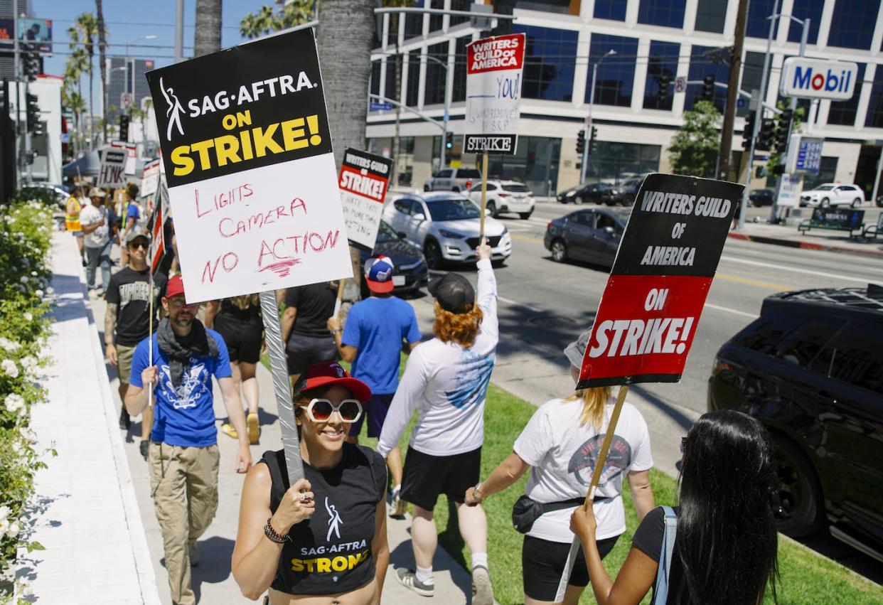 As this picket sign says: lights, cameras, no action. <a href="https://www.gettyimages.com/detail/news-photo/actors-in-the-sag-aftra-union-join-the-already-striking-wga-news-photo/1532806617?adppopup=true" rel="nofollow noopener" target="_blank" data-ylk="slk:Katie McTiernan/Anadolu Agency via Getty Images;elm:context_link;itc:0;sec:content-canvas" class="link ">Katie McTiernan/Anadolu Agency via Getty Images</a>