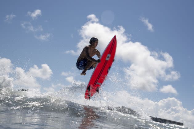 Japan's Kanoa Igarashi rides a wave during a free training session at the Tsurigasaki Surfing Beach. (Photo: OLIVIER MORIN via Getty Images)