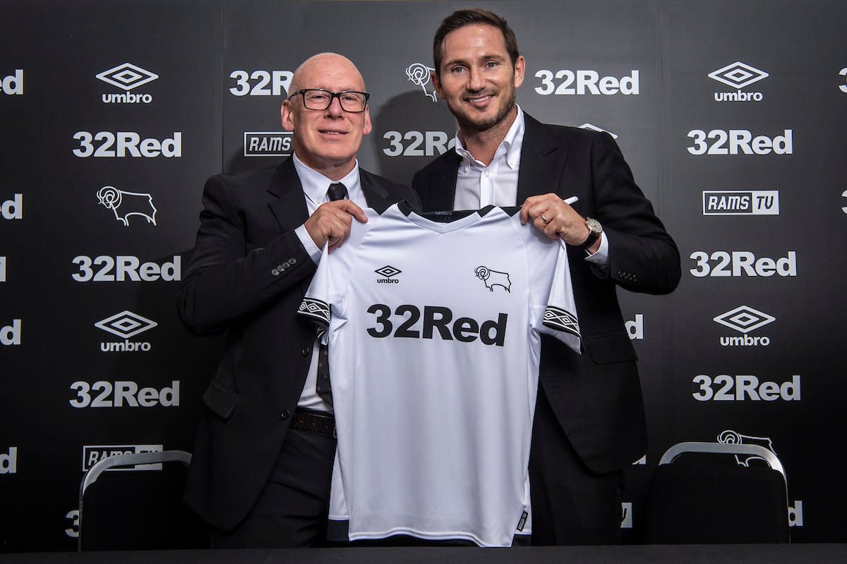 Frank Lampard holds up a Derby County shirt as the Championship club announces their new manager