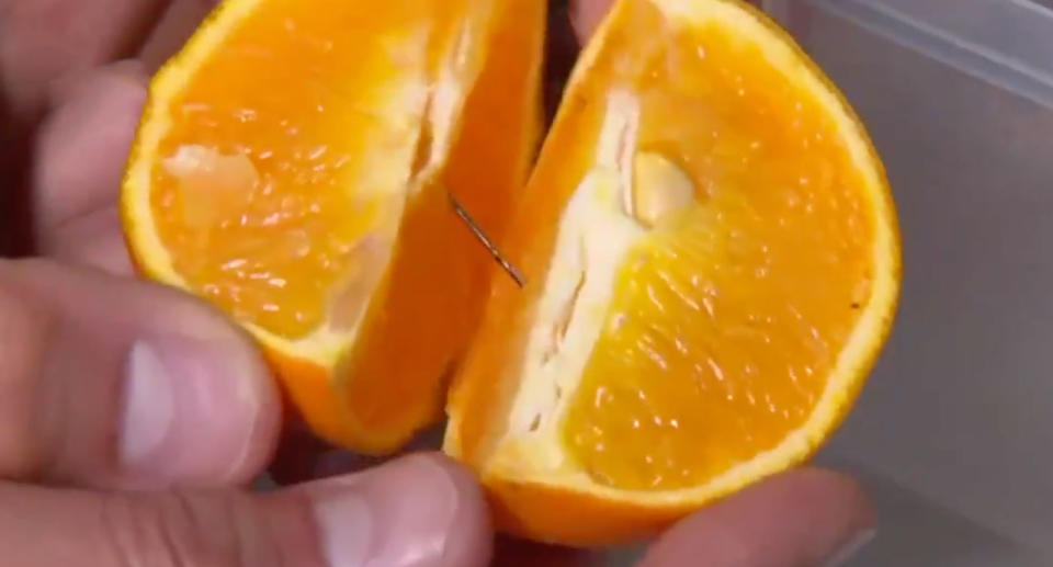 Maddie Sheridan, 4, asked her mum for a piece of fruit on Monday and found a needle inside her orange purchased from Woolworths, Casula. Source: 7 News