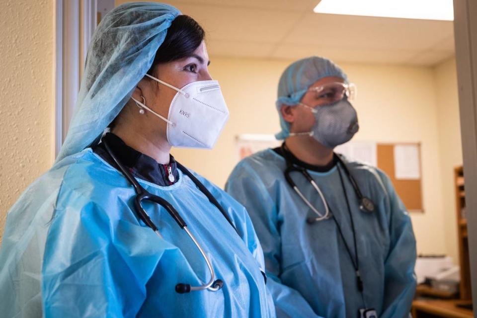 Iris Fuentes and Ricardo Bardales of Clinica Hispana Tu Salud, wear personal protective gear amid coronavirus outbreak Thursday, July 2, 2020, in Fort Worth. 